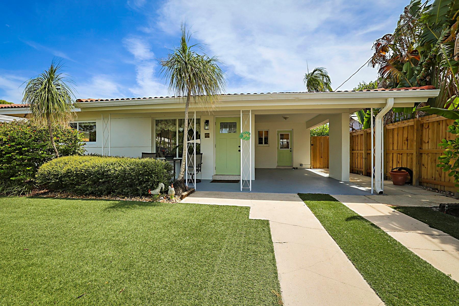 Step into this sunlit 2BR/1BA home with vintage charm and modern updates, nestled in the heart of Oakland Park. Featuring timeless terrazzo floors, beautifully renovated kitchen with walk-in pantry and counter seating, updated primary bath, and expansive Florida room with space for media and office. Situated on a 7250 sq ft lot, this spacious outdoor area is perfect for relaxing or entertaining, with room to garden or simply unwind under the canopy. Oversized patio overlooking mature key lime trees and vibrant tropical landscaping with solar lighting. Additional features include a convenient carport, extra driveway parking, newer A/C and appliances, impact windows, shed, and a turf front yard for low maintenance living. Minutes from Wilton Manors and Oakland Park dining.