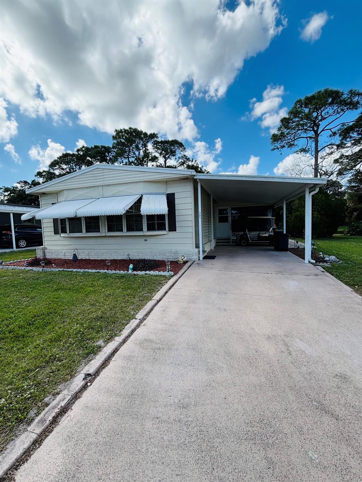Welcome to one of the best homes for sale in Spanish Lakes Golf Village, an active 55+ community in the heart of Port St. Lucie, FL. This 2-bedroom, 2-bath home offers everything you need for comfortable living, with breathtaking views of the golf course and pond right in your backyard. Inside you'll find a partially furnished home with many upgrades and a newer AC unit for added peace of mind. Your land lease includes private golf course,(free) pool, fitness room, pickleball, tennis, shuffleboard , a breakfast cafe and much more. Trash and lawn maintenance included. Don't miss this opportunity-homes in this desirable community don't stay on the market for long!