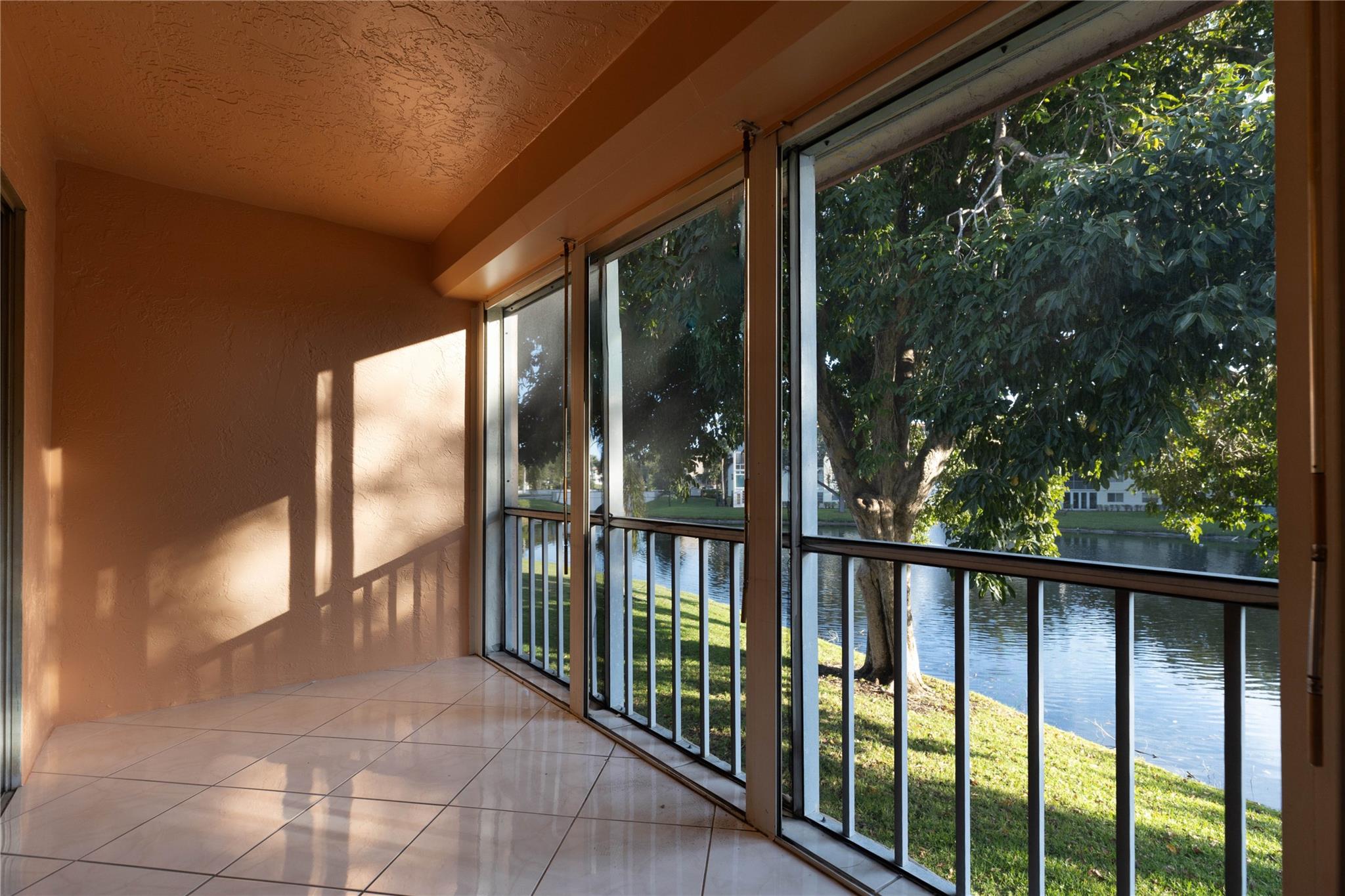 A breathtaking view and a peaceful living environment where life is truly enjoyable. This 2-bedroom, 2-bath condo features soundproof laminate flooring and a spacious walk-in closet in the master suite. The kitchen is equipped with nearly new, high-quality LG appliances, offering both style and efficiency. Updated stainless steel appliances, with granite countertops. Located in vibrant Wynmoor community, you'll enjoy endless activities, including a heated pool, theater, tennis, pickleball, billiards, ping pong, and sauna. Unleash your creativity with pottery, art classes, ceramics, and stained-glass workshops. Convenient shuttle buses are available for your ease, and for golf lovers, it's paradise! Parking is conveniently located right in front of the condo. SELLER IS MOTIVATED!