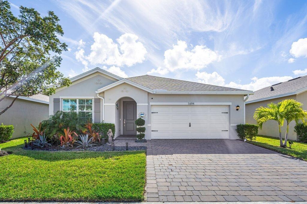 Photo of 1694 NE White Pine Terrace, Jensen Beach, FL 34957 (MLS # R10938960)