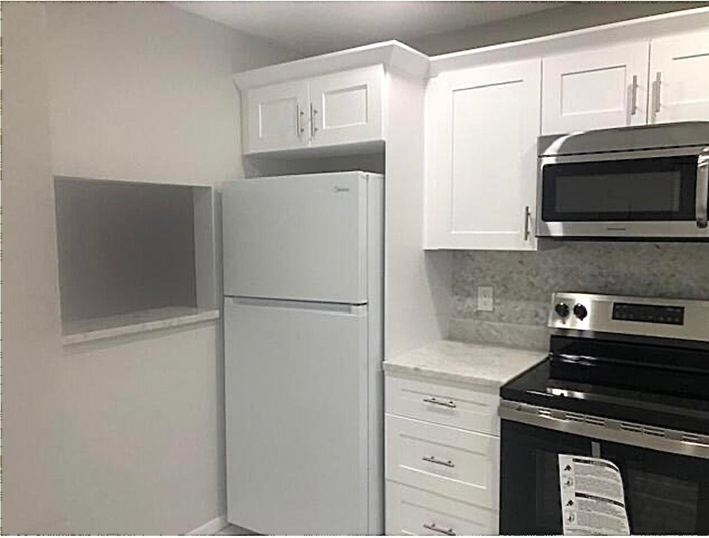 Photo of 21913 Lake Forest Circle #201, Boca Raton, FL 33433 (MLS # R11069788)