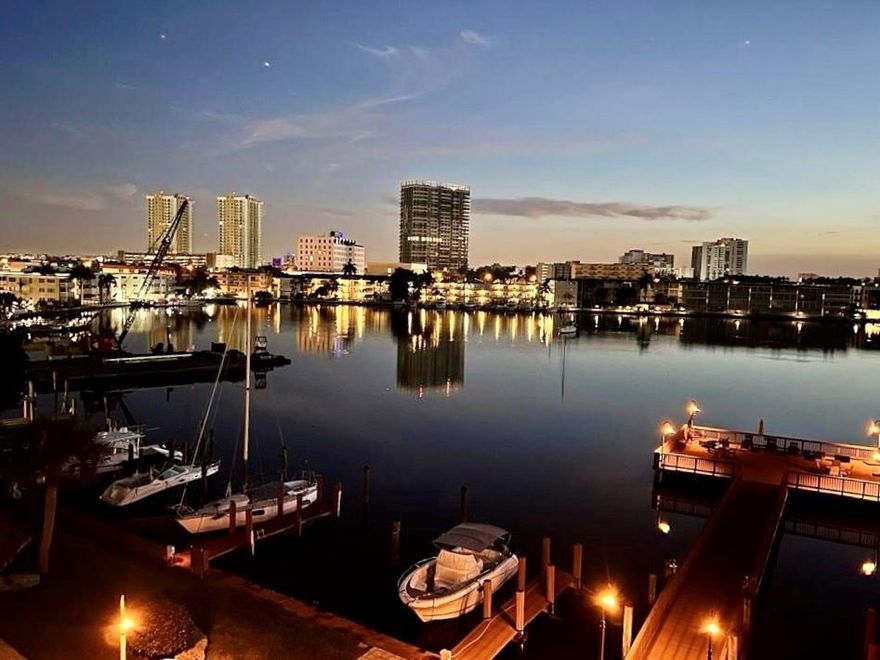 DIRECT WATERFRONT CONDO WITH BREATHTAKING VIEWS. SPACIOUS AND BRIGHT 2 BEDROOM 2 BATHROOM. NEW A/C. NEW HURRICANE PROOF WINDOWS. FRESHLY PAINTED. OVERSIZED BALCONY WITH ACCESS FROM BOTH THE LIVING ROOM AND MASTER BEDROOM. TILE FLOOR. PARTLY FURNISHED: DINING SET (can be removed), MURPHY BED, BALCONY FURNITURE. ON-SITE BARBECUE AND HEATED POOL OVERLOOKING WATER. DOCK EXTENDS INTO THE LAKE WITH FULL ACCESS FOR LOUNGING IN THE SUN. LAUNDRY ROOM ON THE SAME FLOOR. PARKING. STORAGE. WALKING DISTANCE TO THE BEACH, PUBLIX, WALMART, PLAZA WITH BANKS, SHOPS, RESTAURANTS. PET FRIENDLY