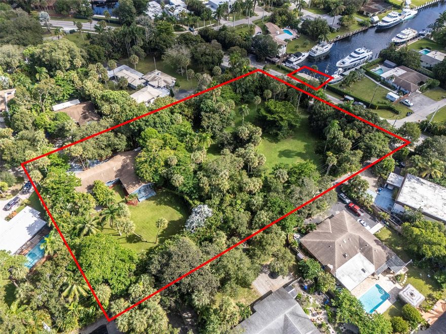 PRICED TO SELL! Endless possibilities to build a dream home retreat, an entertainer's paradise or a visionary developer's big project. Total land $85,042 sf. Sale includes the house, the lot + the 50ft Dock. This is a rare opportunity in the quiet and secluded area of Riverlands Fort Lauderdale.