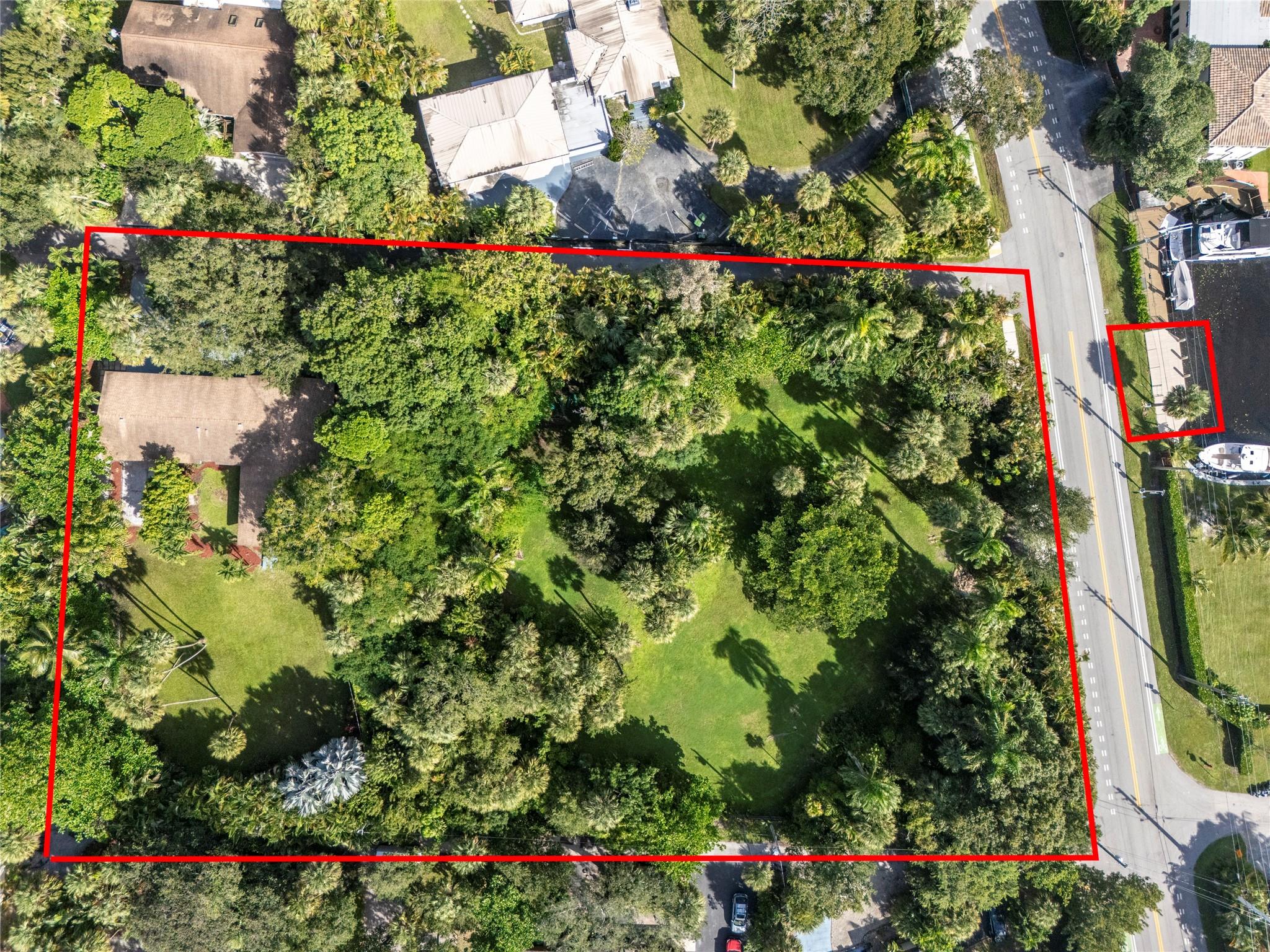 PRICED TO SELL! Endless possibilities to build a dream home retreat, an entertainer's paradise or a visionary developer's big project. Total land $85,042 sf. Sale includes the house, the lot + the 50ft Dock. This is a rare opportunity in the quiet and secluded area of Riverlands Fort Lauderdale.