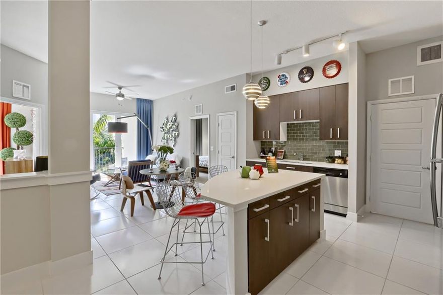 Located in the heart of Sunrise just steps from the Sawgrass Mills Mall, the BB&T Center, and all of Sunrise's best shopping, restaurants and entertainment. Enjoy unparalleled community amenities including two contemporary pools with pool bar and cabanas; fully equipped health and fitness center; yoga studio and spin room; tech lounge; club room with modern arcade game, big screen TV's, and bar area; and covered parking parking. Unit is pet-friendly and offers an expansive dog park and pet spa. Unit features modern kitchen with granite and quartz counter tops and stainless steel appliances; designer tile or plank wood flooring in living spaces; ten-foot ceilings; ceiling fans; spacious bedrooms with ample closet space; and scenic balconies and patios.