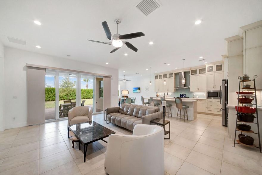 Discover the elegant style and casual comfort of this 3 bedroom, 2.5 bath home located in Andalucia. Spacious open floorplan with a formal dining room, great room and a covered patio. Bright, open kitchen with stacked cabinets, undercabinet lighting, Quartz countertops, glass tile backsplash, stainless steel appliances, double oven, walk-in pantry, a snack bar and a breakfast nook. Luxurious master retreat features a extended California custom walk-in closet, dual vanities finished in Quartz, a soaking tub and a walk-in shower. This charming home features over $105K in upgrades that includes large tile flooring, etched glass double door entrance, upgrade baths with granite countertops, custom mirrors, new ceiling fans, whole house generator and an abundance of natural light. Laundry room with tons of storage and granite countertops.
Enjoy your privacy on the covered and extended patio overlooking your extended, oversized private yard.
Andalucia provides first class amenities that include a a fitness center and a resort style pool. Located close to shopping, dining, entertainment, "A" rated schools and major highways.