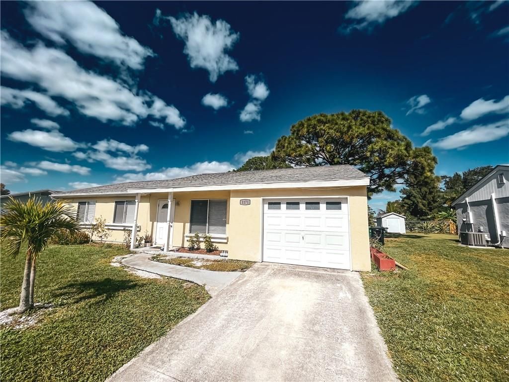Photo of 1171 SE Maxwell Ln, Port Saint Lucie, FL 34952 (MLS # F10366808)