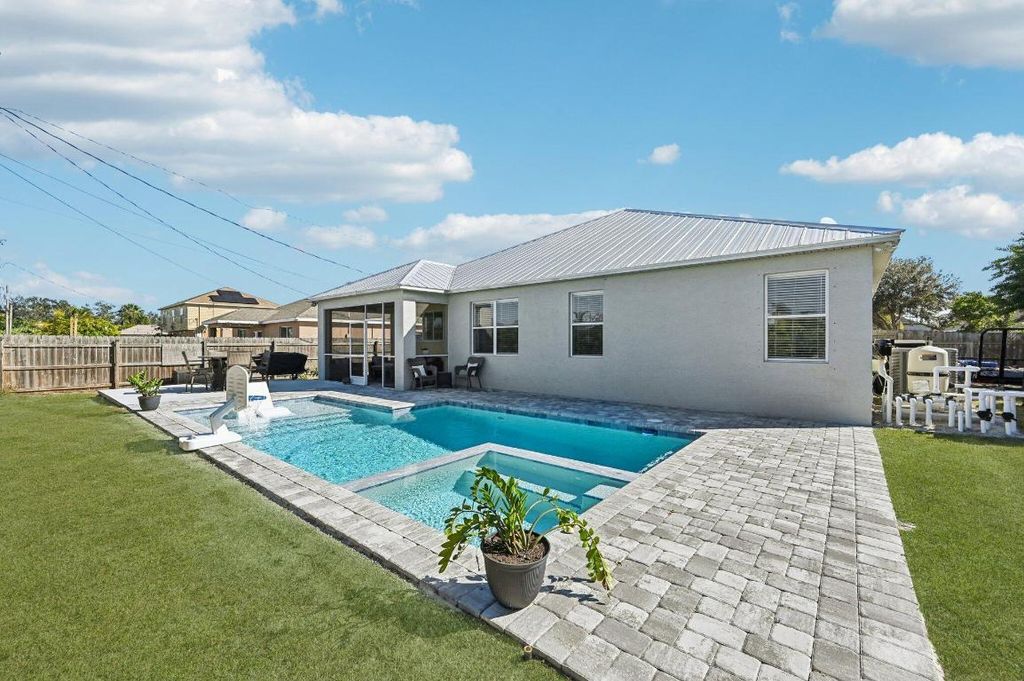 Photo of 941 SW Mcelroy Avenue, Port Saint Lucie, FL 34953 (MLS # R11152094)