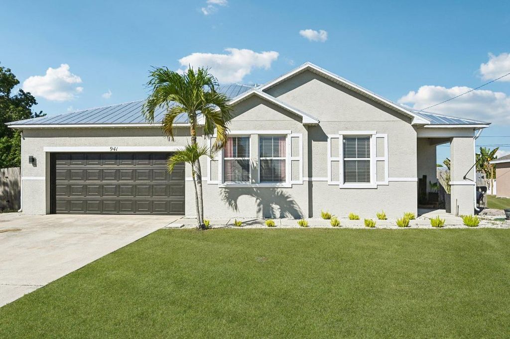 Photo of 941 SW Mcelroy Avenue, Port Saint Lucie, FL 34953 (MLS # R11152094)