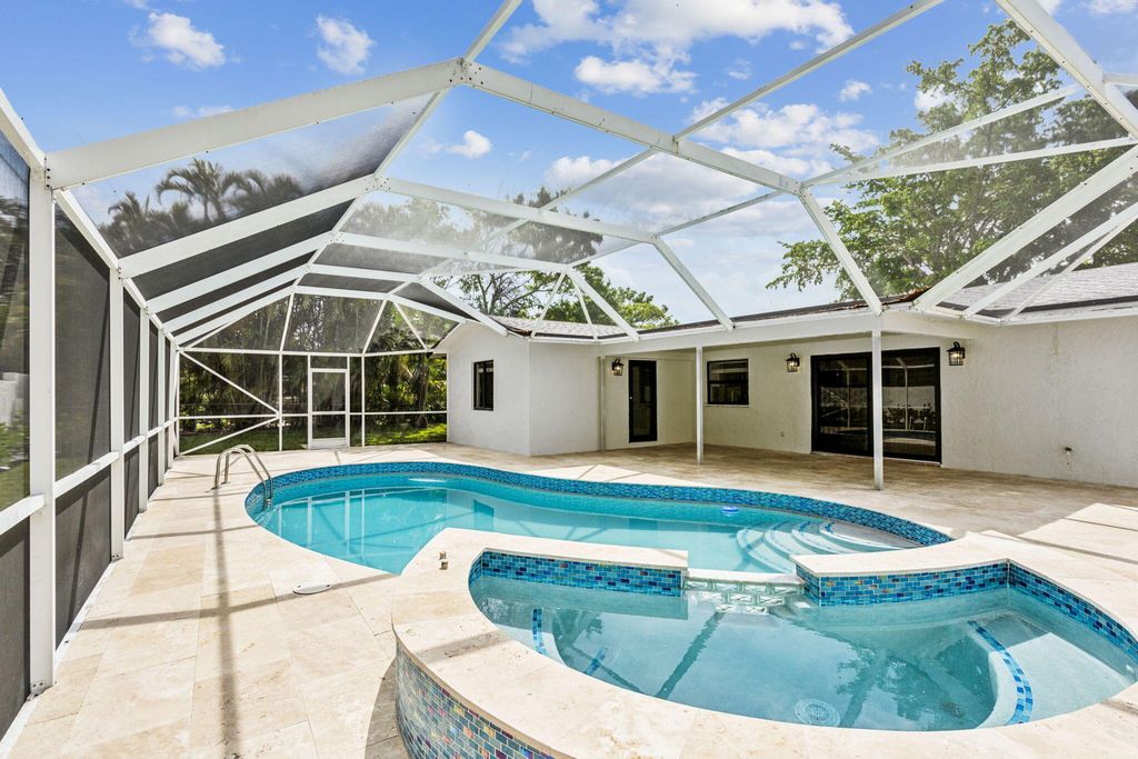 Photo of 521 Curlew Road, Delray Beach, FL 33444 (MLS # R10974824)