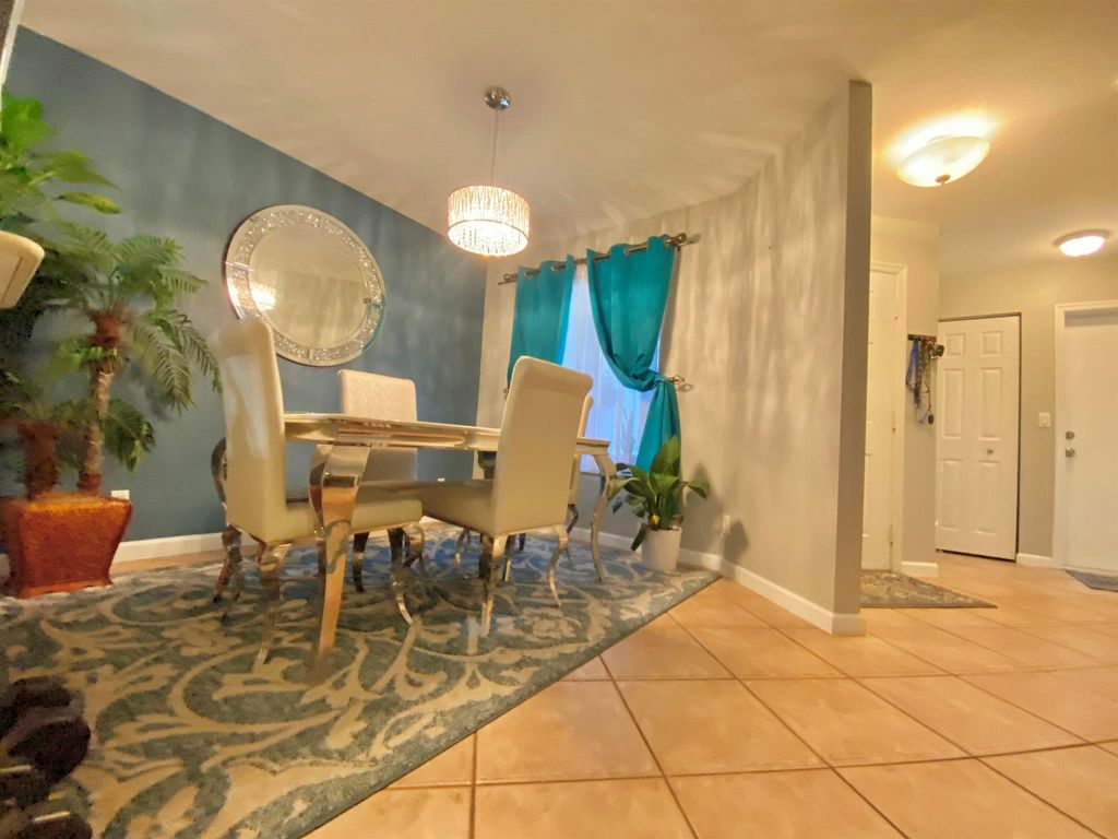 Photo of 6107 Sandy Bank Terrace, Riviera Beach, FL 33407 (MLS # R10937874)