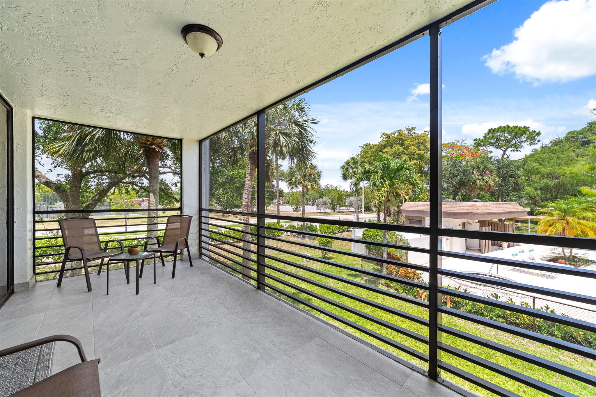 Welcome to this spacious corner unit, the largest model in the building, located in the sought-after gated community of Bonaire Woodmont. This beautifully updated home boasts abundant natural light, luxury vinyl flooring (2022) in the living areas and bedrooms (2025), a modern kitchen with quartz countertops (2022) and stainless steel appliances, two living areas, and two spacious bedrooms. Enjoy the screened back patio with new tiles (2023) and a balcony overlooking the pool, as well as a front porch/veranda. Additional updates include a new water heater and AC (2022). Conveniently situated near major shopping and dining. Seller will assist with the required 12-month HOA escrow. Escrow held and refunded according to association​​‌​​​​‌​‌​​​‌‌​​​‌‌‌​​‌​​‌‌​​​​ policy.