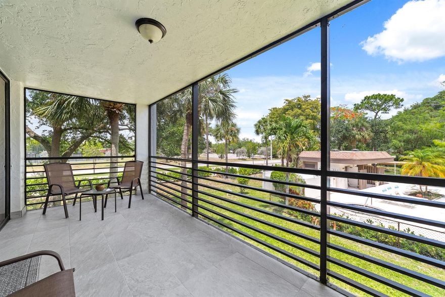 Welcome to this spacious corner unit, the largest model in the building, located in the sought-after gated community of Bonaire Woodmont. This beautifully updated home boasts abundant natural light, luxury vinyl flooring (2022) in the living areas and bedrooms (2025), a modern kitchen with quartz countertops (2022) and stainless steel appliances, two living areas, and two spacious bedrooms. Enjoy the screened back patio with new tiles (2023) and a balcony overlooking the pool, as well as a front porch/veranda. Additional updates include a new water heater and AC (2022). Conveniently situated near major shopping and dining. Seller will assist with the required 12-month HOA escrow. Escrow held and refunded according to association policy.