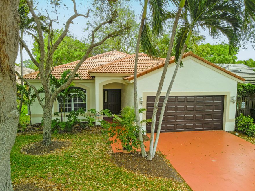 Discover this fantastic Delray Beach home, located just west of downtown in a beautiful HOA community. Enjoy community amenities including tennis courts, a pool, front lawn care, and cable as part of the maintenance package. This charming home features 3 bedrooms, 2 baths, and a 2-car garage. It boasts new appliances, a newer AC, and hurricane protection for all openings. The fenced backyard is perfect for outdoor enjoyment, and the freshly painted interior and exterior provide a modern, refreshed look, THIS IS A CONCRETE BLOCK CONSTRUCTION HOME. Situated on a cul-de-sac, this home welcomes any size dog as permitted by the HOA. Don't miss out on this exceptional opportunity!
