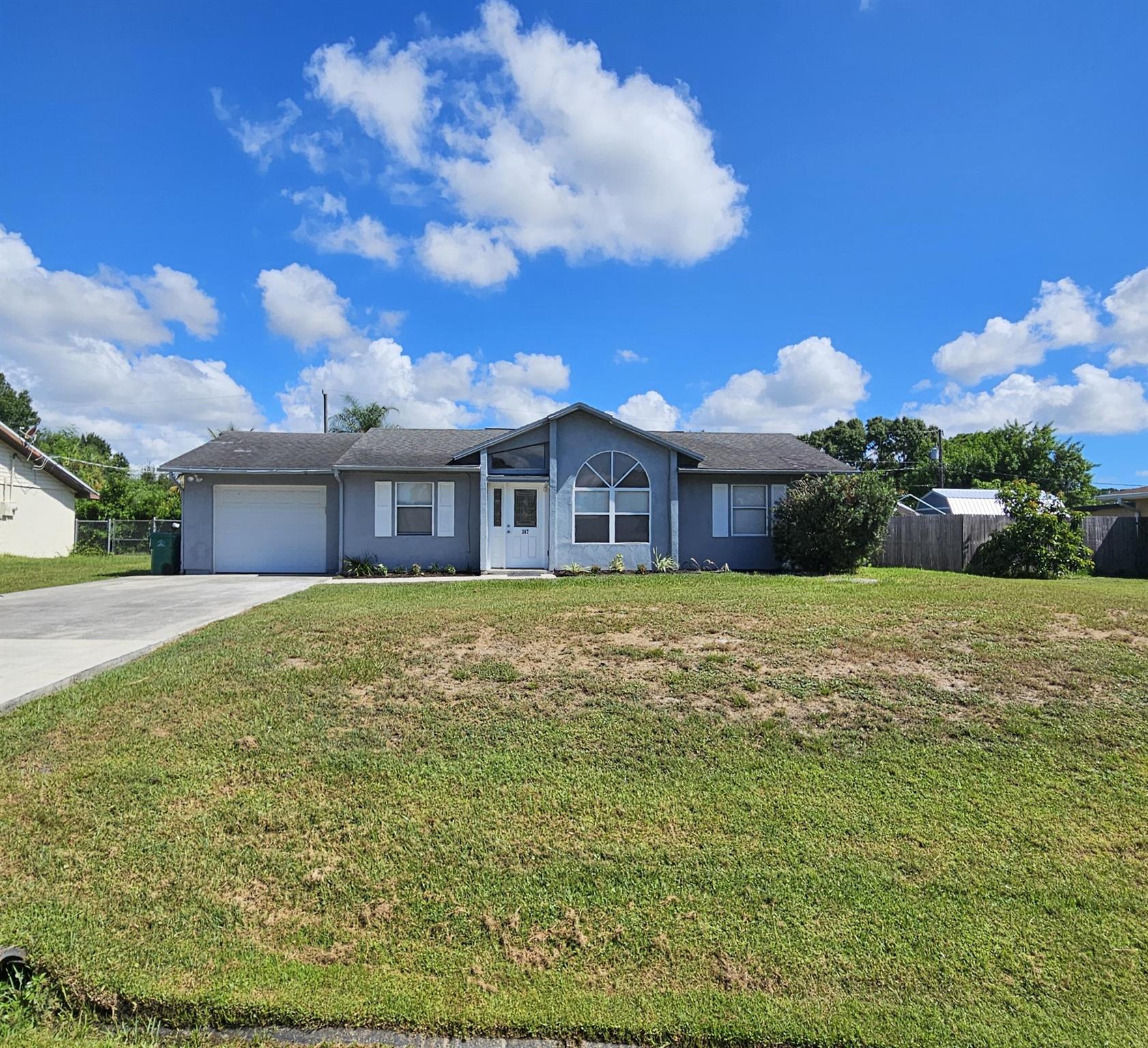 Well maintained just updated 3/2 in Port St Lucie. Vaulted ceilings in the main living area give this home the feel of being much bigger. Tile throughout and a new kitchen!! A one car garage attached and a big fenced back yard with a nice screened in back porch. Call us to set up an appointment today before this gem is gone