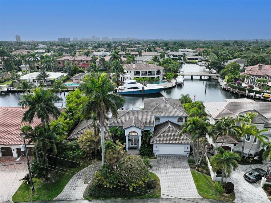 This is the perfect property to build new construction or renovate and design to your personal style. Located on a deep water canal, with no fixed bridges, in the highly desired City of Lighthouse Point. This home has 90 ft. of water frontage with a large wood deck just minutes from the intercoastal and Hillsboro Inlet. With a priceless location, value is certainly in the Land. There is a large inground pool, outdoor bar, and boat dock. Ideally located in close proximity to shopping, restaurants, and Beaches. Come see for yourself and make this tropical oasis yours!
