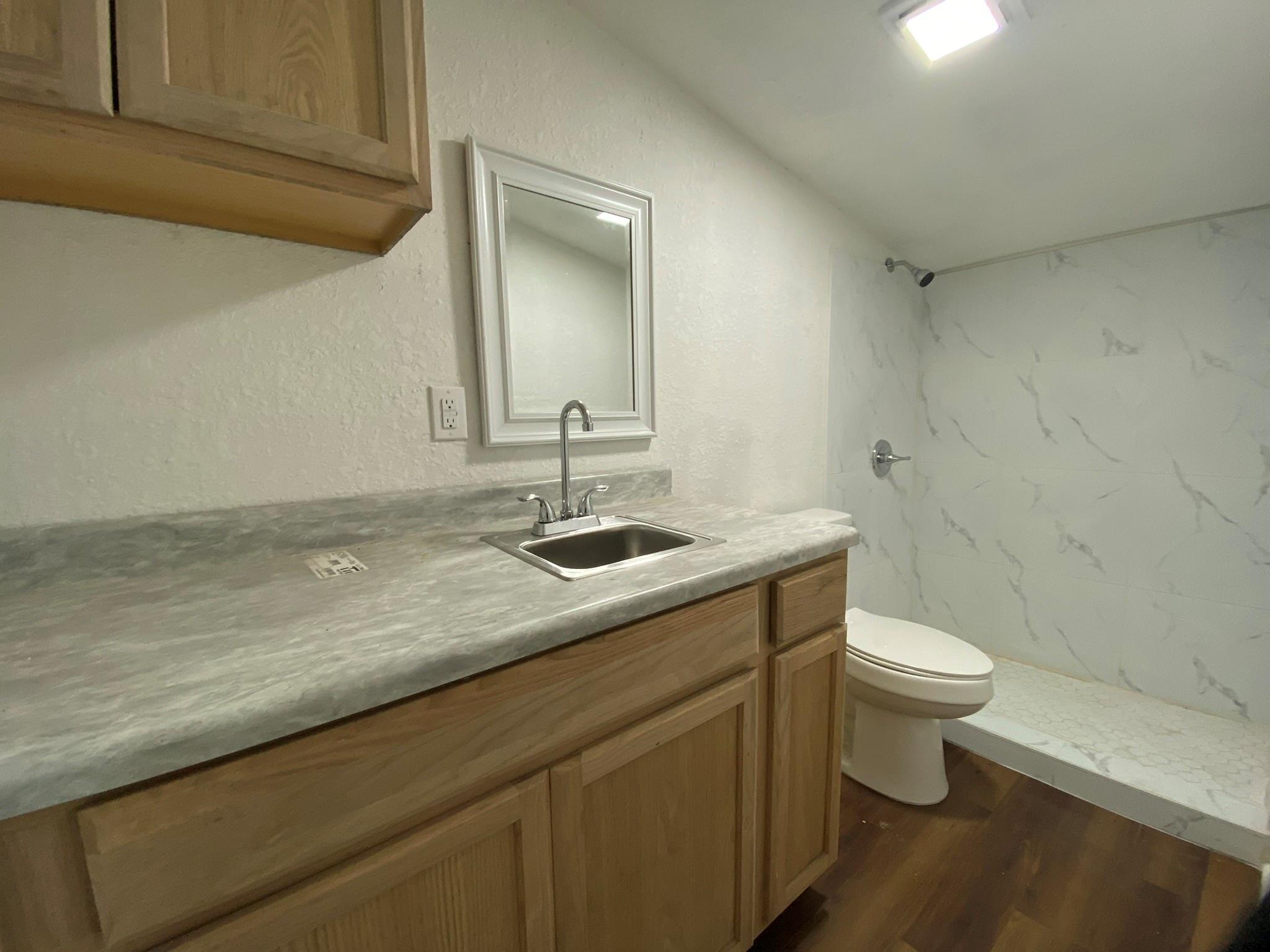 This detached unit with open living and private full bath. Enjoy the convenience of on-site free laundry with your own designated days, plus included parking. A utility package available at additional cost covering electric and water for hassle-free living.
