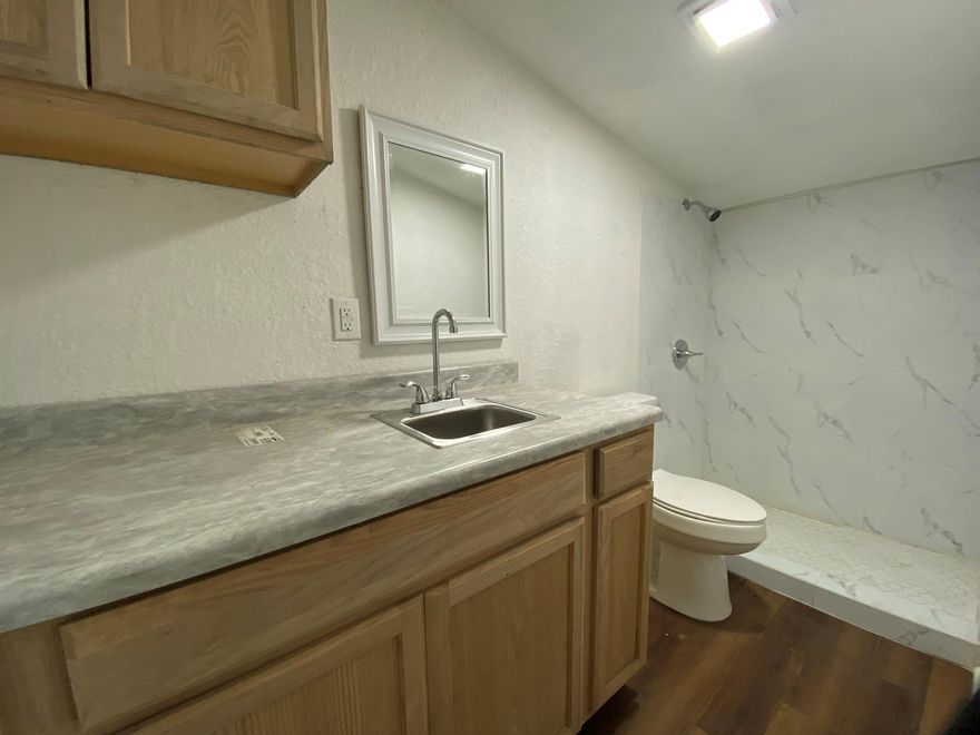 This detached unit with open living and private full bath. Enjoy the convenience of on-site free laundry with your own designated days, plus included parking. A utility package available at additional cost covering electric and water for hassle-free living.