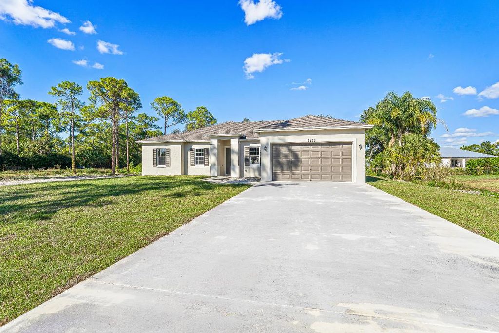 Photo of 15235 Tangelo Boulevard, The Acreage, FL 33412 (MLS # R11155492)