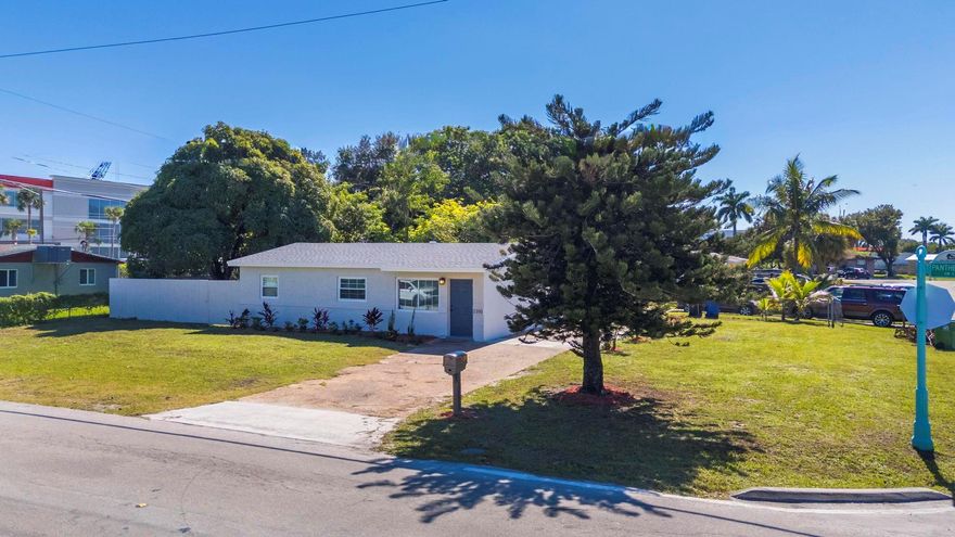 This tastefully renovated 4-bedroom, 2-bath home offers modern comfort and timeless style. A brand-new roof has been installed, and the home includes impact windows for added safety and efficiency. Inside, you’ll find new waterproof vinyl plank flooring, fresh interior paint, baseboards, and interior doors throughout. The kitchen features new quartz countertops, gray shaker cabinets with plywood construction, and brand-new stainless steel appliances. Enjoy outdoor living in the fenced backyard—perfect for entertaining or relaxing. A detached storage shed with washer and dryer hookups adds extra convenience. Located near I-95, the Turnpike, downtown Fort Lauderdale, schools, shopping, and the beach, this home combines quality updates with a convenient location. Move in and enjoy!