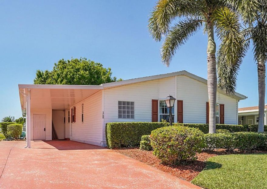 Waterfront! This former model home has 2 bedrooms, den, a custom kitchen with crown molding, island, granite counters and an interior laundry room with slop sink.  The sunroom, overlooking the water view, has been updated with new flooring.   You will enjoy the blend of comfort & leisure. And, in this 55+vibrant community, residents enjoy a wealth of amenities, including cafe, theatre, golf, tennis, pickle ball, swimming and clubs that cater to diverse interests.  There's truly something for everyone in Savanna Club with its 3 clubhouses, pools, fitness centers and so many activities.   Located on a cul-de-sac, wider driveway, hurricane panels, new roof 2018, HVAC 2024. Land Lease.