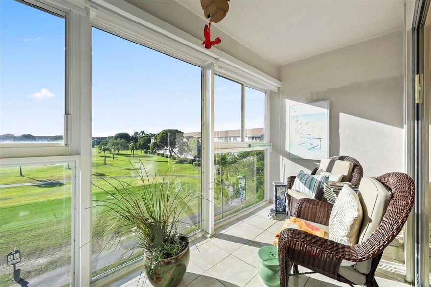 Enjoy effortless living in this beautifully updated fourth-floor 2 bedroom, 2 bathroom residence with serene golf course and lake views. The open-concept kitchen creates a bright and open concept that features upgraded stainless-steel appliances, custom cabinetry, granite countertops, and stone backsplash. Recent improvements include hurricane-impact windows, new A/C, in-unit washer/dryer, and custom blinds throughout. The spacious primary bedroom offers a walk-in closet, plus the added convenience of attic storage. Relax on your private patio or take advantage of the pool located just across the building.