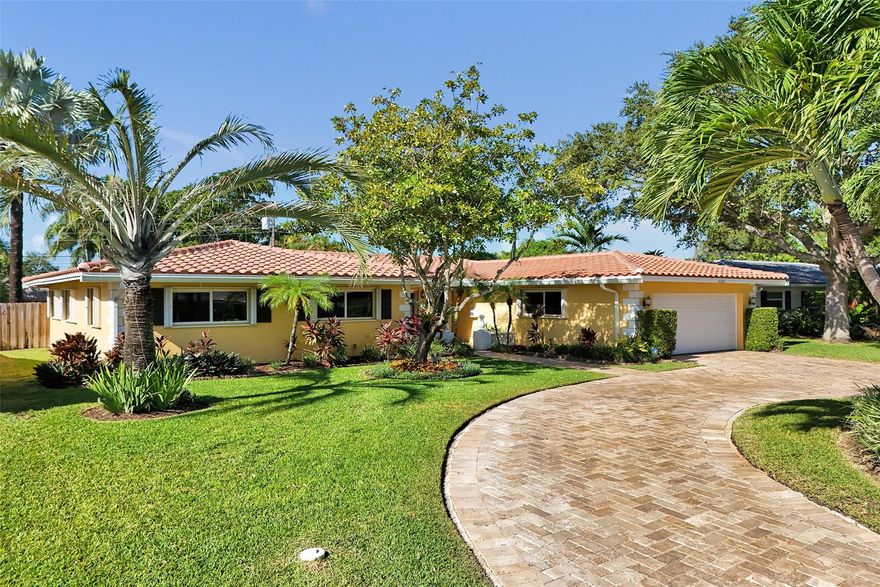 Experience the relaxed South Florida lifestyle in this private tropical retreat located in the heart of Coral Ridge Isles. This 3-beds, 2.5-bth home with a flexible convertible 4th bed designed for comfort, and easy living. The gourmet kitchen features granite countertops, a copper sink, stainless-steel appliances, and a wine bar that opens to a dining and family area perfect for entertaining. Step outside and unwind by the refinished Diamond Brite pool under the tiki hut, complete with a built-in grilling area and lush landscaping. Nestled in one of Fort Lauderdale’s most desirable neighborhoods, enjoy quiet, tree-lined streets just minutes from the beach, top dining and shopping, Holy Cross Hospital, and private schools like Pine Crest, Westminster Academy, and St. Mark’s.