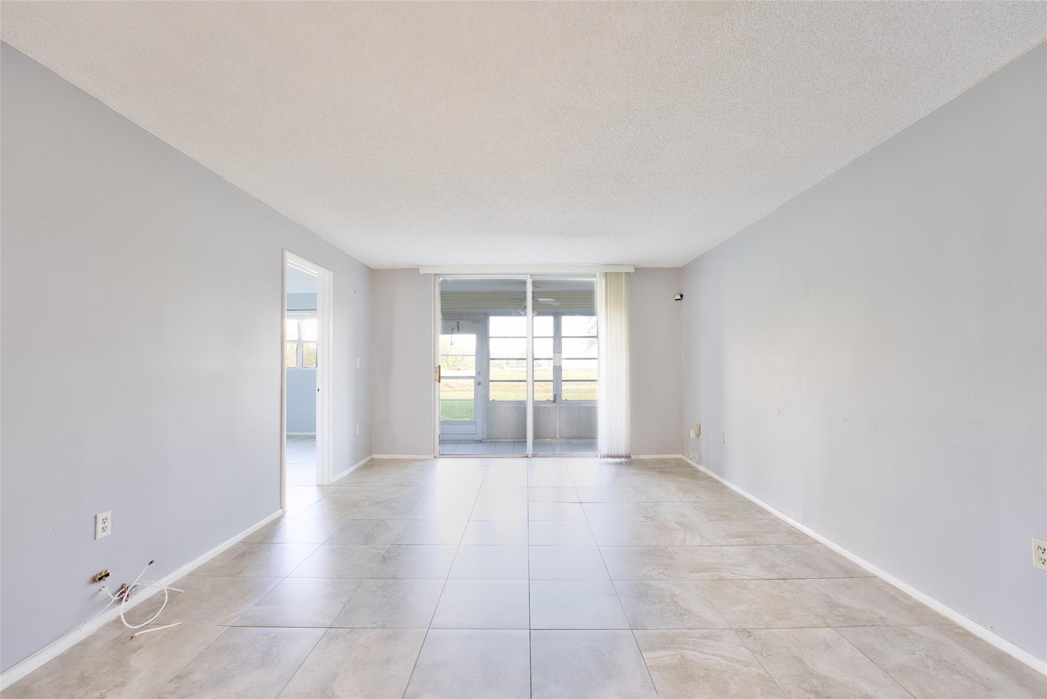 BEAUTIFUL 1st floor unit. 2 bedrooms and 2 baths with screened patio and great view!!! Totally udated, new kitchen cabinets, new appliances and counter tops, updated bathrooms and tile throughout. New A/C and water heater. Deep walk in closet in good sized master bedroom. Large closet at the entry for storage. Great location, convenient to major roads, shopping and restaurants. Very active clubhouse with lots of amenities and activities: gym, tennis, clubroom, planned activities, city shuttle, 2 pools and more. A bus stop is across the parking lot in front of this building. Assn says 55+ community minimum.
