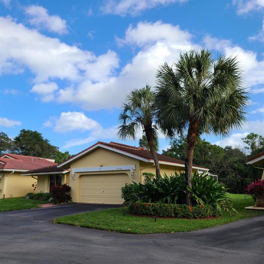 Beautiful corner lot patio home with a great view of the lake and preserve area in the rear.  Enjoy sitting in your screened in patio overlooking the peaceful fountain in the water.  There is an enclosed Florida room, vaulted ceilings in the living and formal dining area.  Eat in kitchen overlooks the large side grassy area.  A two garage.  Two full bedrooms and baths and the kitchen are awaiting your remodeling touches. Bring your ideas and imagine the possibilities when this home is redone.! Across from the semi private/public Deer Creek Golf Club. No membership required to live in this ideal Deer Creek location. Close to shopping, dining, major transportation and of course the beach! Seller is open to offers.