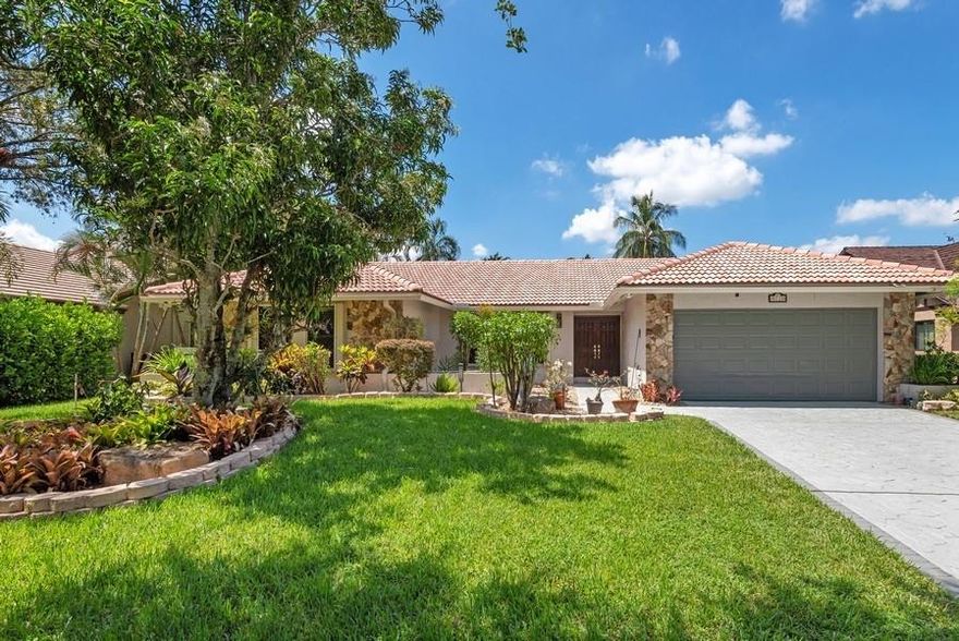 Reduced to $749,999.00 to SELL NOW! One of the finest interior waterfront lots in Jacaranda Lakes with a double water view!! Absolutely beautiful views of the canal, passive green space and lake from your FR, Kitchen, eating area, pool and dome screened patio! This open floor plan greets you immediately upon entering with a great-room like effect-impact sliding doors open from the FR to the patio bringing the outdoors in! This home is hurricane ready w/impact windows & doors and/or accordion shutters, hurricane garage door and hurricane proof screening on patio that unrolls , ADT alarm system, LG washer & dryer in utility room, 2 hanging shelves in gar. stay, & fenced back yard with room to play! Roof 2005. Ready for the new owner to paint and decorate to their liking!Hurry and see today! 4/2 Stacked BR, Open living area with vaulted ceilings, Beautiful double waterfront view in back, Impact windows and doors plus accordian shutters and 1 panel for cabana bath door, Fenced back yard.  Room to play in back!