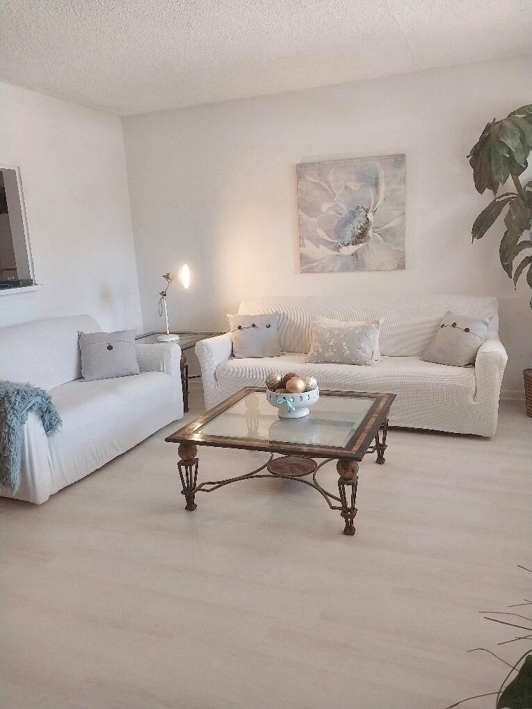 Charming 1 1/2 FIRST FLOOR condo at Century Village! Located in a quiet 55 plus gated community! Prime location near the main entrance on Okeechobee Blvd. Professionally landscaped! Walking distance to the library, Dunkin Donuts, hair salon, and banks! Just minutes from the beaches! This condo features a lush tropical BBQ seating area for your enjoyment and relaxation! Clubhouse has its own movie theater, Las Vegas style shows, a variety of classes, over 20 pools, sauna, health club, sailing, trash removal, tennis and courtesy bus! Condo is owner occupied! Staged by an interior designer! New light and bright vinyl floors and fresh paint added! Don't miss this GROUND FLOOR opportunity!