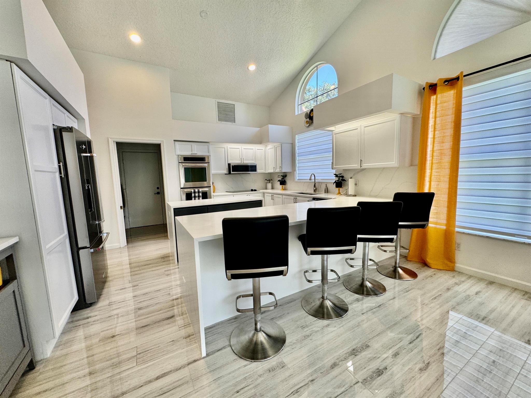 FULL GOLF MEMBERSHIP INCLUDED! Experience South Florida living at its finest in this fully remodeled 3-bedroom, 3-bath home, with 24-hour gated & guarded security, in the prestigious, resort-style Aberdeen Golf & Country Club community, with beautiful pools, a state of the art exercise equipment, yoga classes, restaurants, bars, and so much more!The community features a beautifully designed Jim Fazio 18-hole golf course, offering a rewarding challenge for players of all skill levels. Tennis and pickle ball enthusiasts will enjoy access to 14 Har-Tru tennis and 6 pickleball courts.