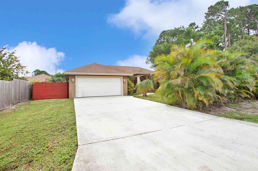 Port Saint Lucie living at its finest! This 3BR/2BTH Split-floor plan Single Family Home is sitting on just over 10,000 SQ FT of land. New A/C installed in 2020 and New Water Heater Installed in 2022! Featuring kitchen with Stainless Steel Appliances. This property features a 2 Car Garage plus an oversized driveway and plenty of room on the side of the home for all your toys. Bring your Boats, RV's, Four-wheelers, Dirt-bikes and Motorcycles! NO HOA! NO HOA MONTHLY FEES! NO RENTAL RESTRICTIONS!