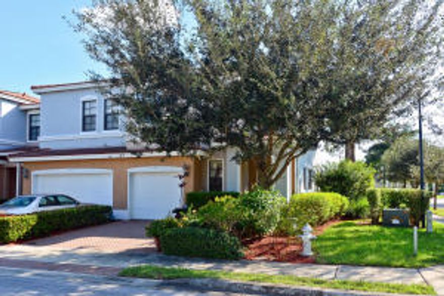 This 3 bedroom, 2.5 bathroom, 1 car garage, this hidden gem in an all age community. Home features stucco exterior with covered entry. Upgraded eat in kitchen, granite slab counters and Whirlpool appliances. Tiled floors in the living areas, ceiling fans and carpet in bedrooms and neutral painted interior. Slider doors from the living area open to the extended patio and a beautiful lake view for those relaxing evenings. End unit townhome affords extra windows and added light into the living and bedroom areas.The extended Master suite offers plenty of room for desk, recliner or exercise. Master bathroom offers dual sinks, separate shower with spa jets, a roman tub. The guest suites are perfect space to accommodate any guest! Garage is fitted with an Elfa organizational system too!