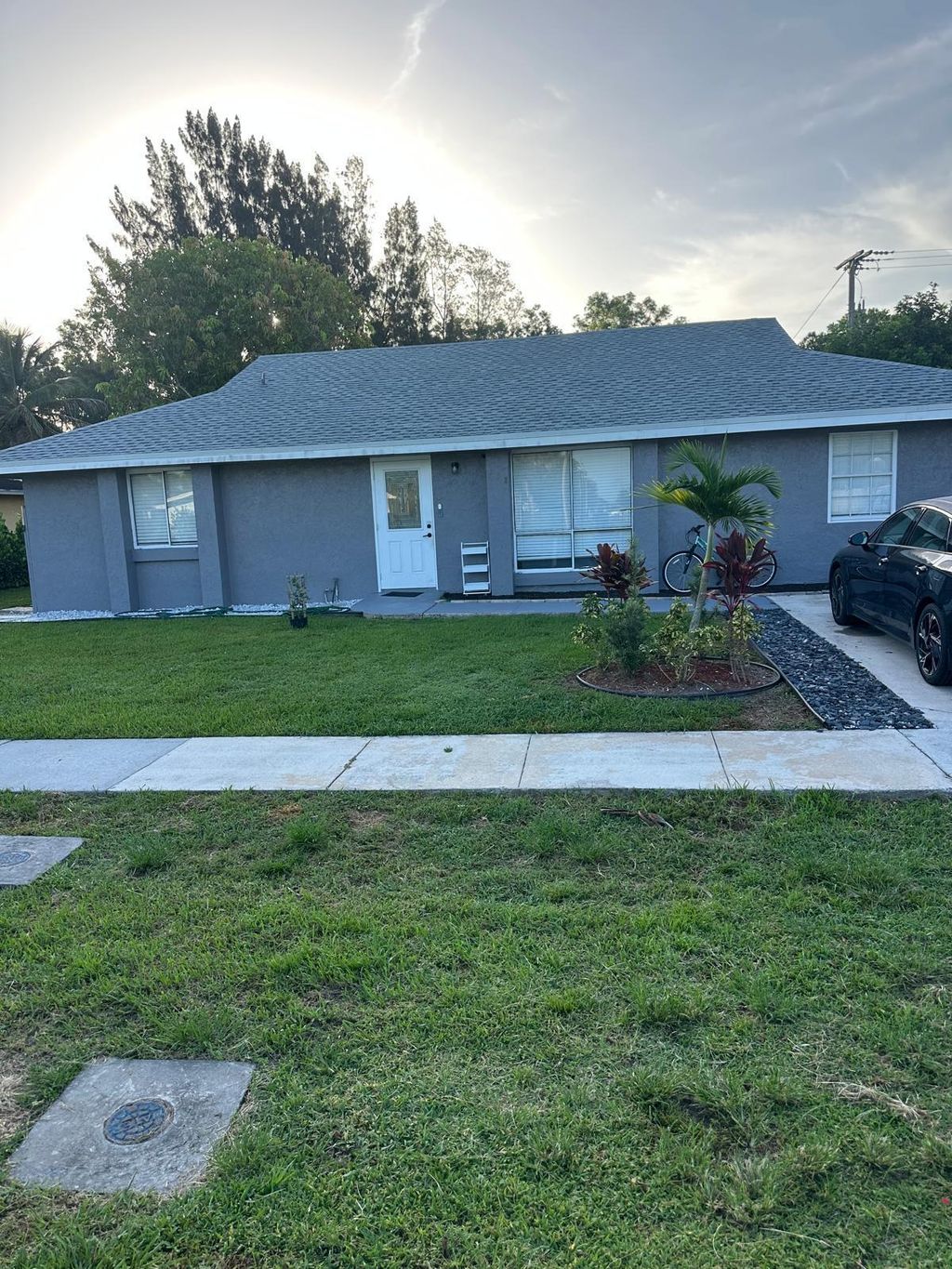 Photo of 880 CAMELLIA Drive, Royal Palm Beach, FL 33411 (MLS # B26053204)