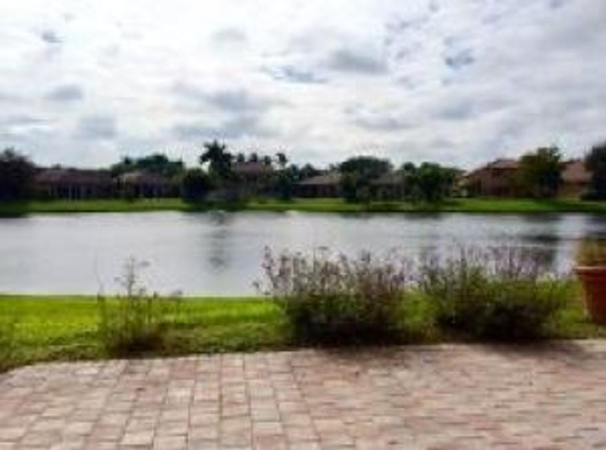 A BEAUTIFUL 4 BR/2.1 BATH LAKE FRONTHOME IN THE POPULAR ADDISON TRACE GATED COMMUNITY!SPLIT BEDROOMS AND A TWO CAR GARAGE.ZONED TO GREAT A SCHOOLS !KITCHEN HAS GRANIT COUNTERS  AND STAINLESS STEEL APPLIANCES ,UPGRADED ELCTRIC HURRICAN SHUTTERS THROUGHOUT ,EXTRA LARGE YARD OVER LOOKING THE LAKE .WALK IN CLOSETS WITH BUILT INS.NATURAL TILE FLOORS AND LAMINATE .CENTRAL VACUUM,GREAT CLUB HOUSE WITH A POOL,TENNIS ,AND EXSERCISE ROOM. THIS IS TRULY A GREAT HOUSE FOR YOUR FAMILY!!!