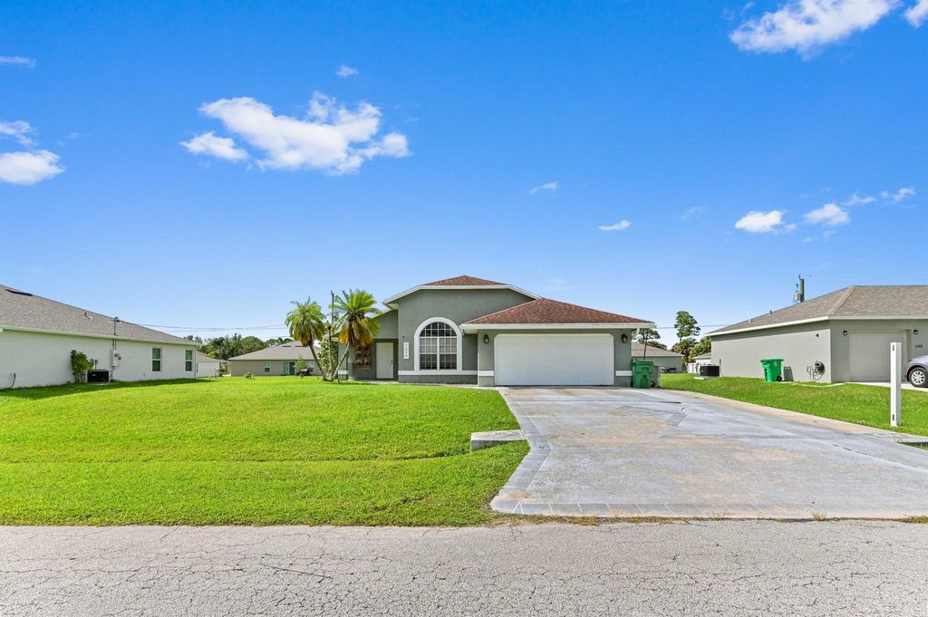Photo of 1290 SW Melrose Avenue, Port Saint Lucie, FL 34953 (MLS # R11117519)