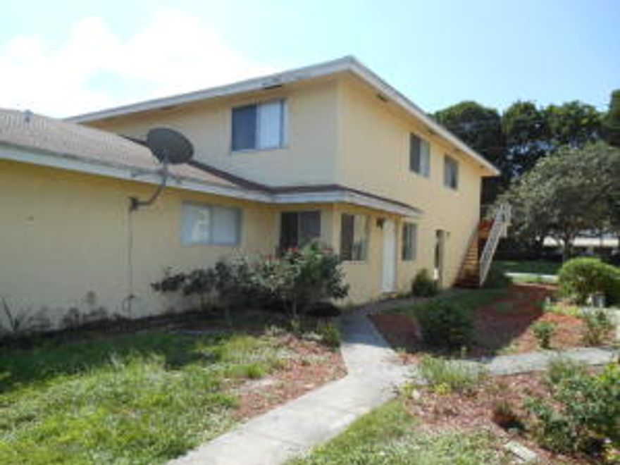 Ground floor condo in a 4 unit building. Unit has had some updating in the past 5-6 years. Kitchen has newer cabinets and appliances and bathroom has been redone. A/C has been replaced about 6-7 years ago. Downstairs is tiled and bedrooms have carpet. Good investment property. Tenant in place on month to month lease.