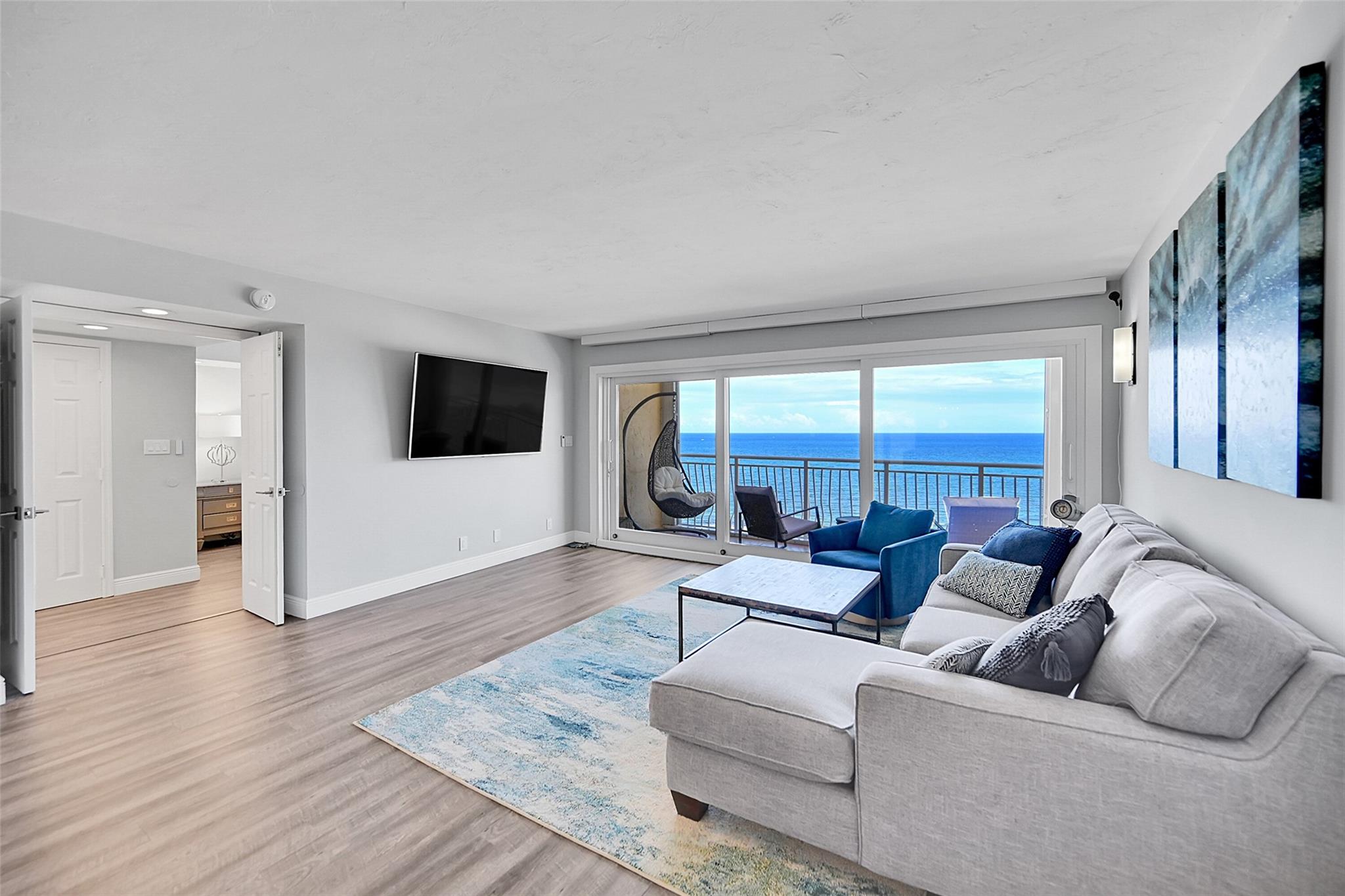 Stunning Oceanfront Penthouse with direct, panoramic views of Pompano Beach! Experience coastal luxury living in this fully renovated 2- bedroom, 2- bath Penthouse, perfectly positioned overlooking the iconic Pompano Beach Pier. This incredible residence features new flooring throughout and has a spacious open- concept layout centered around a gorgeous kitchen with large island- ideal for entertaining. Dramatic collapsible sliding glass doors blend indoor and outdoor living, opening up to the private balcony with breathtaking, unobstructed ocean views. Enjoy water views from every room, huge walk in closet in primary and washer and dryer in unit! Both bathrooms are being remodeled and you'll be the first to enjoy them. Amazing restaurants, shopping, sand and surf just outside your door.