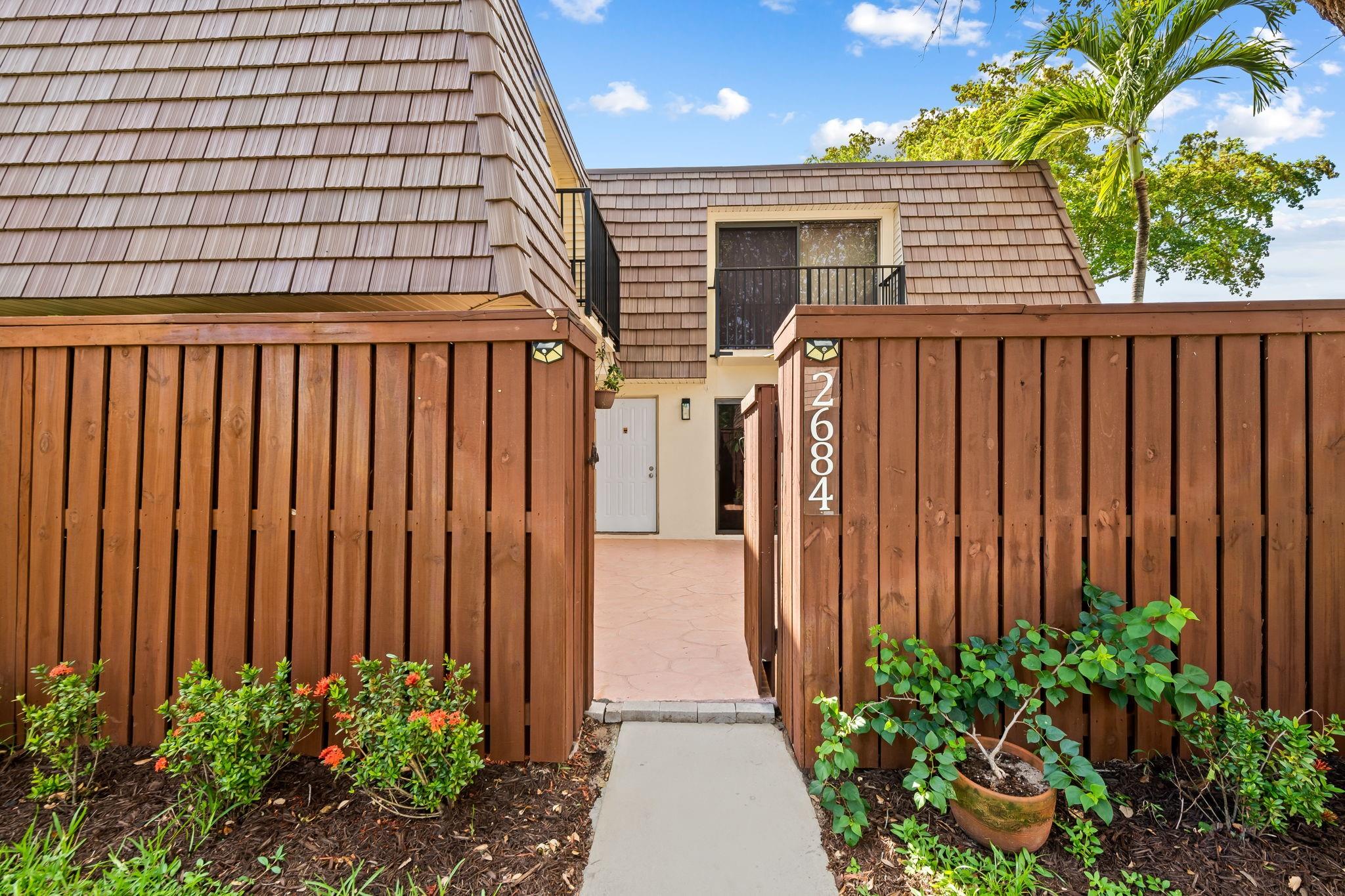 Low-maintenance living in the heart of Deerfield Beach! No minimum down payment required. Spacious 2-bedroom, 2.5-bath townhome features a 2021 roof, 2018 AC, and 2019 water heater. Enjoy a private fenced courtyard for entertaining, grilling, or relaxing. Kitchen has upgraded appliances ideal for any cooking enthusiast, and the large living room has sliding glass doors that open to the courtyard. A gorgeous built-in living room wall unit with storage adds both style and function. Downstairs includes a half bath with a full-size washer and dryer. Upstairs, both bedrooms have private balconies. Primary suite boasts a large walk-in closet and a stunning en-suite bath with dual sinks and a custom walk-in shower finished with Carrera marble. Pet-friendly community with a beautiful pool.