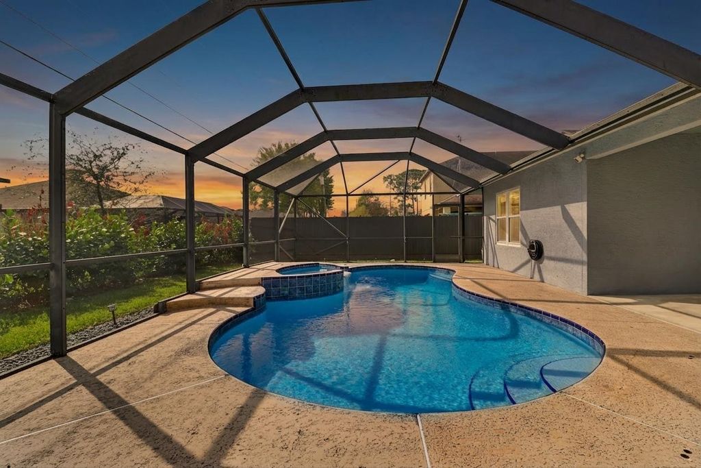 Photo of 3411 SW Esperanto Street, Port Saint Lucie, FL 34953 (MLS # B26002109)