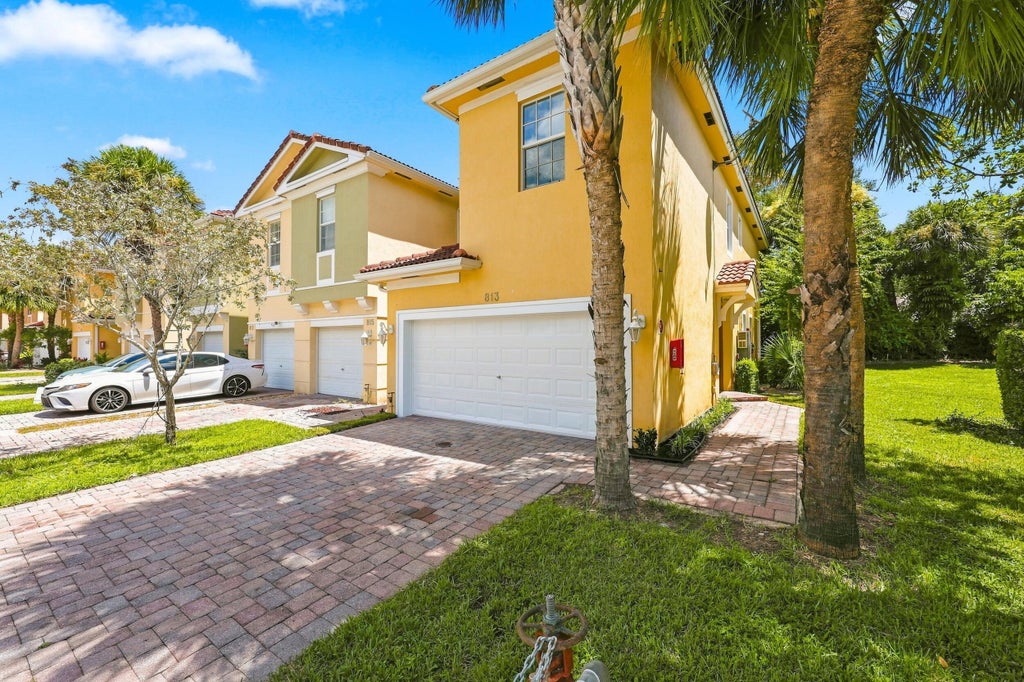 Photo of 813 Pipers Cay Drive, West Palm Beach, FL 33415 (MLS # B26070133)