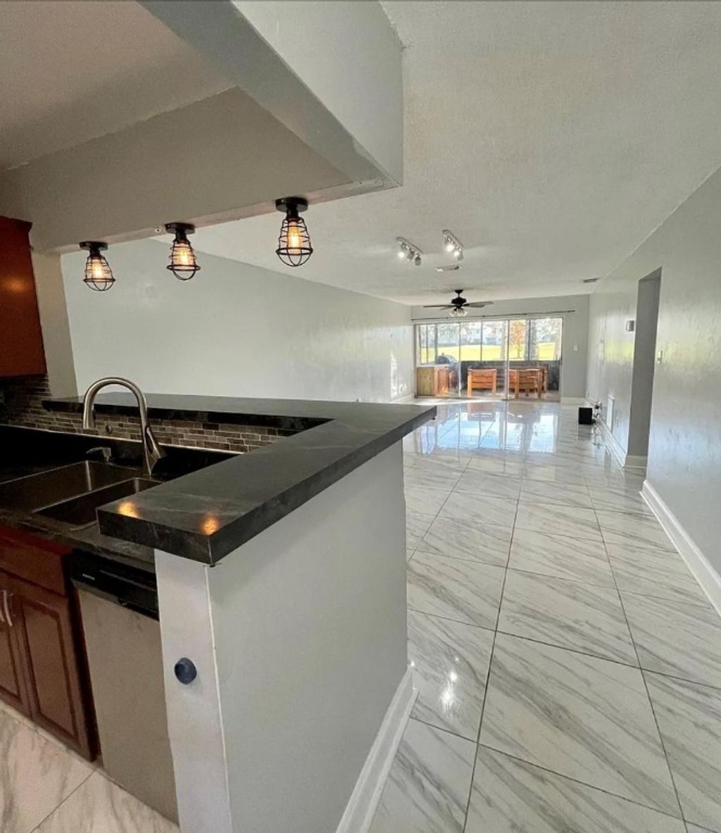 Photo of 9540 NW 65th Street #D8, Tamarac, FL 33321 (MLS # F10499242)