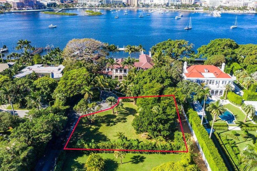 Tucked away in the heart of town and close to Palm Beach's main attractions and arteries, this secluded .44 acre vacant parcel has a generous buildable envelope (13,075 sf).  Envision planning and creating an exceptional in town villa surrounded by gracious private gardens enhanced by an historic Wild Almond Tree as a natural sculptural backdrop.  This can be your special hideaway on the last original Clarke Avenue estate lot available.