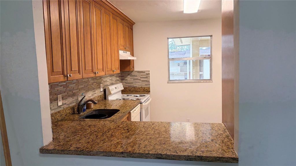 Photo of 5515 N Lakewood Circle #122, Margate, FL 33063 (MLS # F10550769)