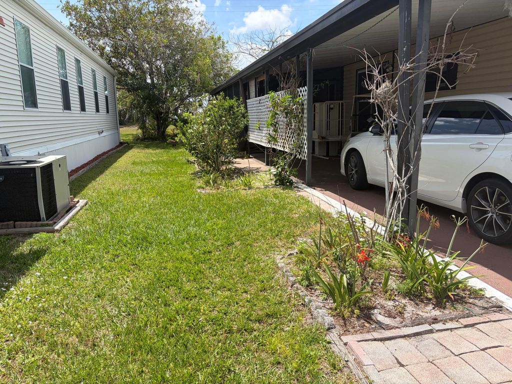 Photo of 109 East Caribbean, Port Saint Lucie, FL 34952 (MLS # R11144188)