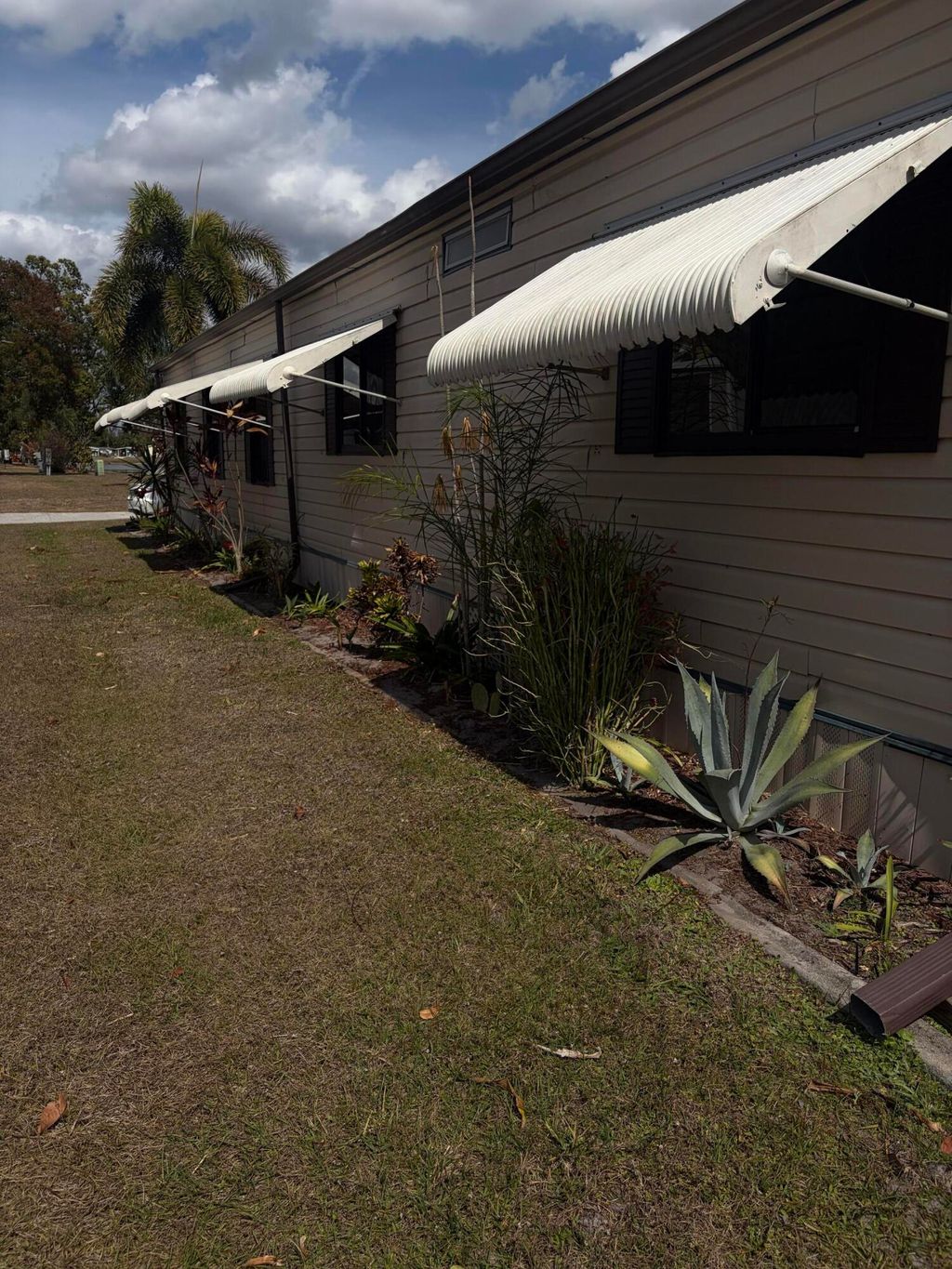 Photo of 109 E East Caribbean, Port Saint Lucie, FL 34952 (MLS # R11144188)