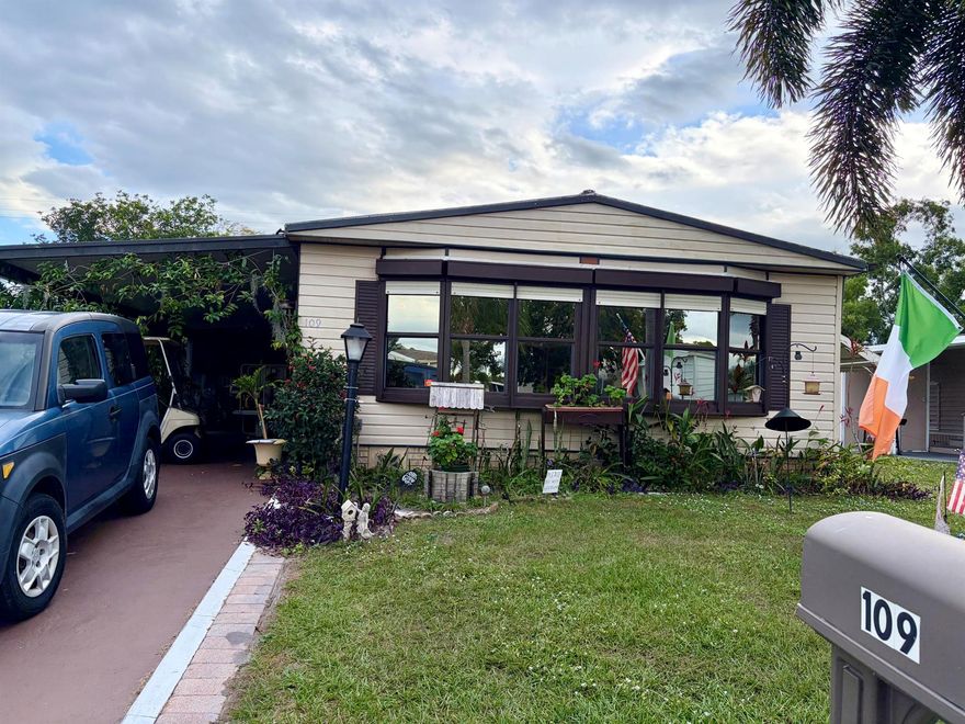 Welcome to 109 East Caribbean in a great 55+ golf community with loads of amenities. This spacious 2-bedroom 2 bathroom is nestled in a great location with no neighbors behind backing up to a large field area (great for leisurely enjoyment). There is a large screened area for those morning coffee or evening cookouts and golf cart included! This home comes with a hydraulic lift at the side entry just off the driveway. The large bedroom located in the back of the home with a large walk in closet and private en suite. The guest room is just down the hall with additional bath with tub. The laundry has newer washer and dryer and a freezer and great storage, but the storage doesnt stop there... 2 large storage sheds at the back of the home for all your extras! There is a big bonus room at the