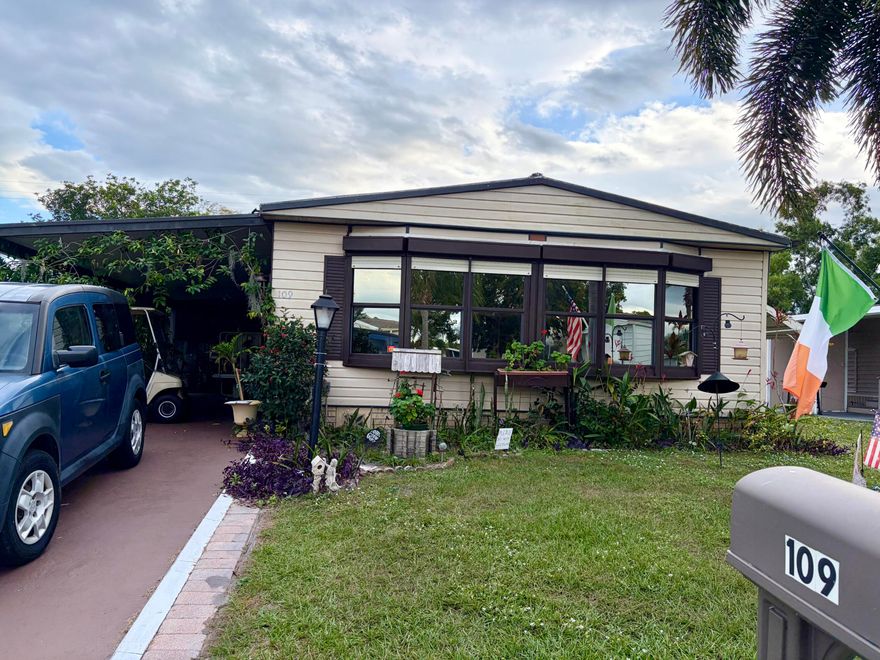Welcome to 109 East Caribbean in a great 55+ golf community with loads of amenities. This spacious 2-bedroom 2 bathroom is nestled in a great location with no neighbors behind backing up to a large field area (great for leisurely enjoyment). There is a large screened area for those morning coffee or evening cookouts and golf cart included! This home comes with a hydraulic lift at the side entry just off the driveway. The large bedroom located in the back of the home with a large walk in closet and private en suite. The guest room is just down the hall with additional bath with tub. The laundry has newer washer and dryer and a freezer and great storage, but the storage doesnt stop there... 2 large storage sheds at the back of the home for all your extras! There is a big bonus room at the