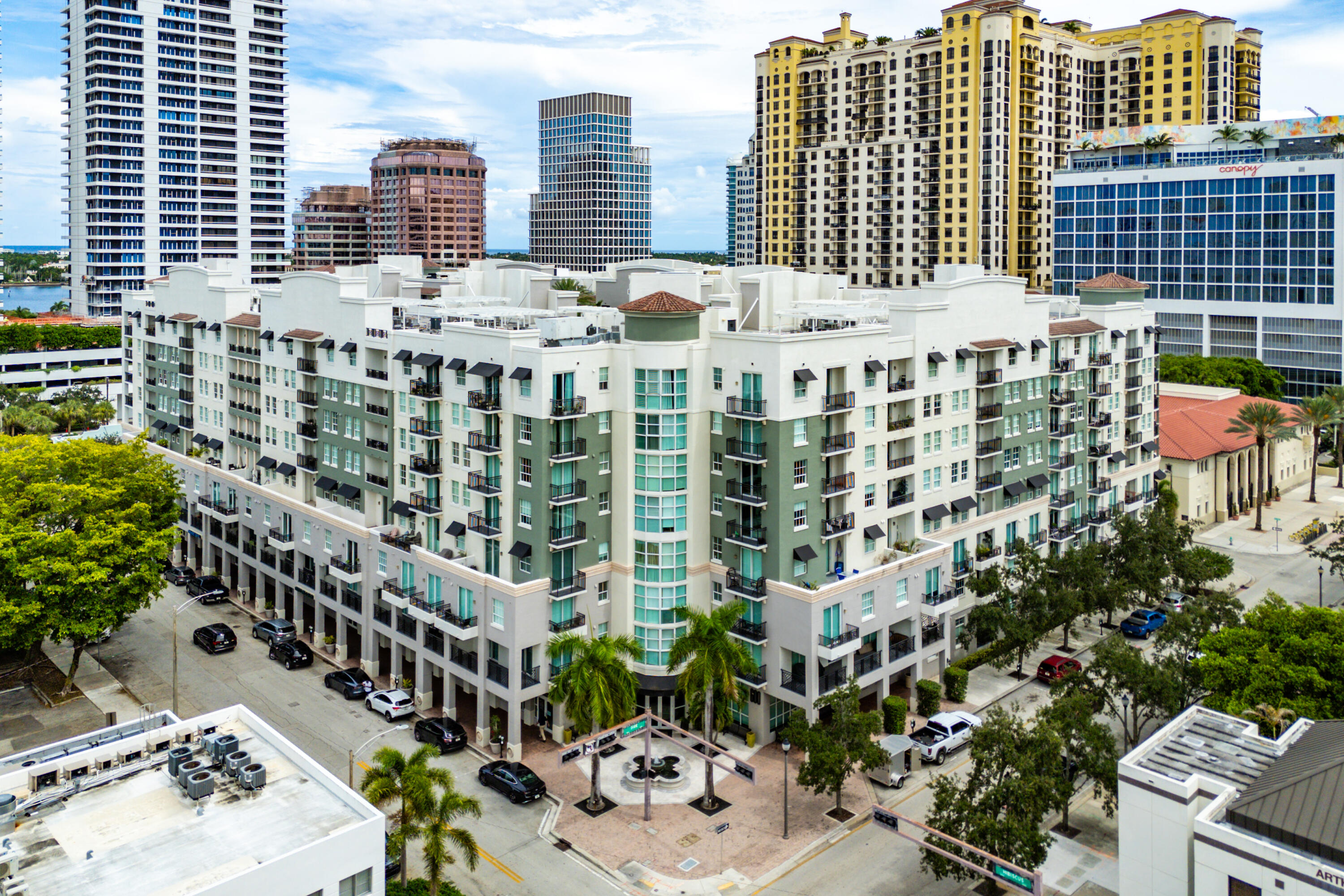 Natural light and southern exposure from this elegant high-floor residence, offering partial Intracoastal views from the balcony. The split floor plan features two private master suites for ultimate comfort. An open-concept design highlights a chef kitchen with upgraded cabinetry and granite counters, flowing into sunlit dining and living areas. The primary suite includes a private balcony, custom walk-in closet, and spa-like bath. This home blends convenience and privacy. Enjoy resort-style amenities: heated pool, hot tub, fitness center, renovated clubroom, business center, bike storage, and 24-hour attended lobby with Wi-Fi. Garage parking included. Prime Downtown West Palm Beach location mins to Palm Beach. Short term lease available from Sept 2025 - Jun 2026. Furnished or unfurnished